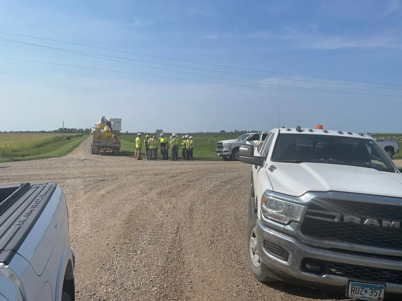 A Karian Peterson crew in high-visibility gear gathered at a job site